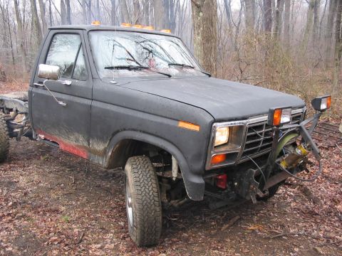 1985 Ford F-350 - This truck appears to be an early 1980s Ford F-Series, possibly a 1980-1986 model, equipped with a plow mount.