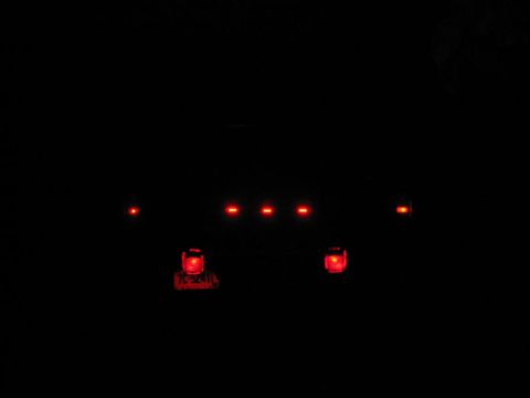 1985 Ford F-350 - Red marker lights illuminate the dark top of a truck.