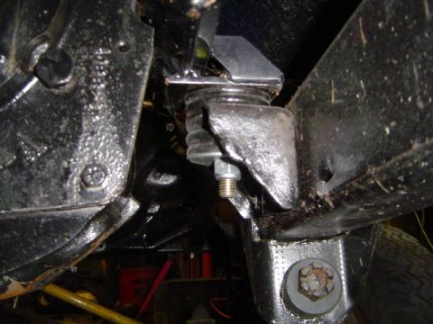 1971 Ford Bronco - Close-up view of a suspension mounting bracket with a rubber isolator, likely from a vehicle's undercarriage.