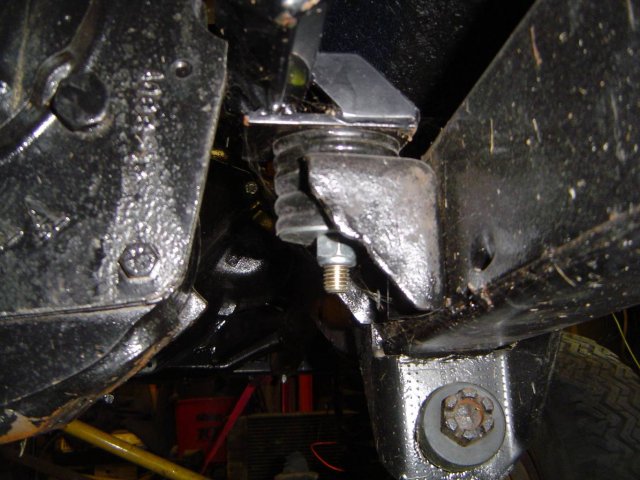Undercarriage suspension mount with rubber isolator