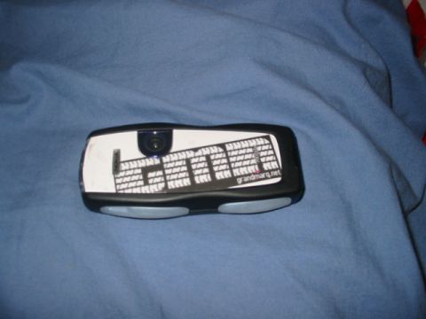 1997 Ford Crown Victoria - A car alarm remote is shown against a blue cloth background.