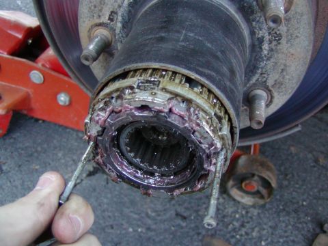 1991 Ford Bronco - replace two of the screws you removed from the hub cover...Use those as a handle to skide the hub assembly out
