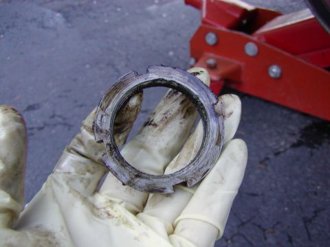 1991 Ford Bronco - outer lock ring removed. this may be tight. be careful to keep the tool straight.. i belive the tq is like 75 ft lbs