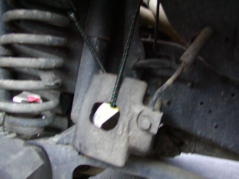 1991 Ford Bronco - hammer the pins out and hang the caliper out of the way. Toss the pads. Use a bungee to hang the caliper. DONT LET IT HANG BY THE BRAKE LINE