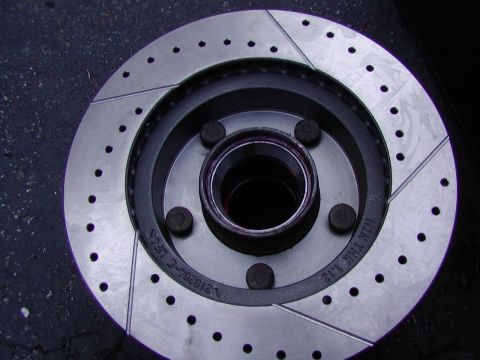 1991 Ford Bronco - new races installed. Lay the hub back in the rotor and press the wheel studs back through. I had to use a hammer and a punch its tuff
