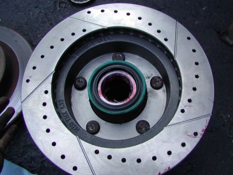 1991 Ford Bronco - once the studs are back in the rotor and hub should be tight. No wiggles between the two. Now install the new wheel seal. Hammer it on unti…