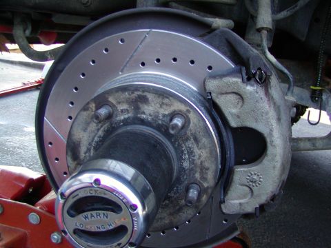 1991 Ford Bronco - reinstall the hub cover. Install the new hub and replace your calipers. Get you wheels on Now rinse and repeat