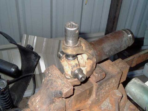 1984 Ford Bronco - Remove snap ring, use a vise to press out the cap or drive out with a 5/8" socket
