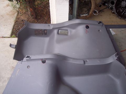 1995 Ford Probe - These interior trim panels are shown laid out, likely for inspection or replacement.