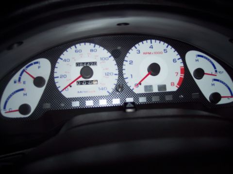 1995 Ford Probe - Close-up of a car's interior dashboard gauges, including the speedometer and tachometer.