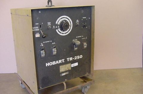 2005 Ford Mustang - Hobart TR-250 welder unit with various controls and output terminals visible.