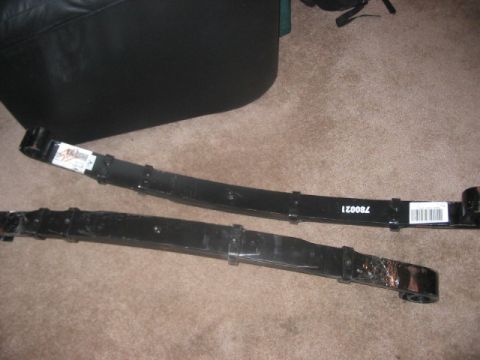 1991 Ford Bronco - Two leaf springs are shown, likely for a vehicle's suspension system.