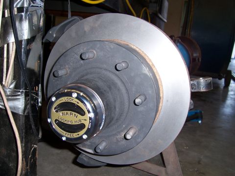 1983 Ford Bronco - Close-up of a Warn locking hub and brake rotor assembly.
