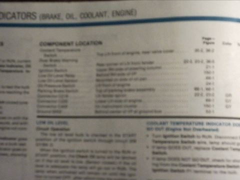 1991 Ford LTD Crown Victoria - A blurry close-up photo of a factory service manual page headed 'INDICATORS (BRAKE, OIL, COOLANT, ENGINE)', with a Component Location table…