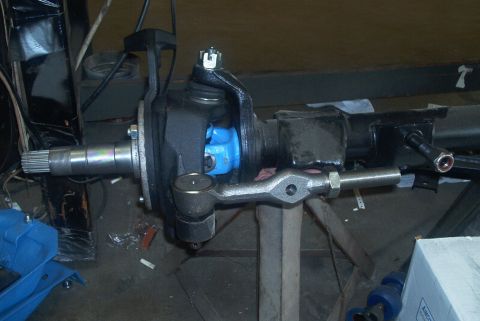 1983 Ford Bronco - This image shows a close-up of a vehicle's steering knuckle and tie rod assembly, likely during a repair or upgrade.