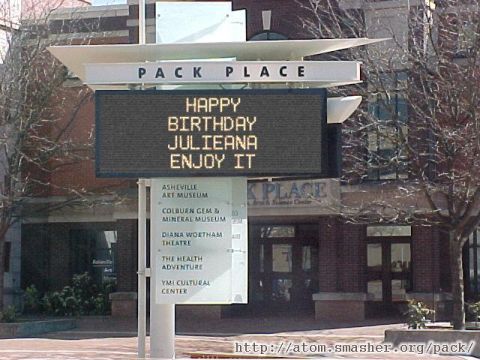 1986 Ford Bronco - A digital sign at Pack Place wishes someone a happy birthday, with a list of attractions below.