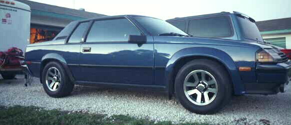 Blue 1980s Toyota Celica Supra hatchback coupe parked on gravel