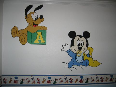 2002 Ford Taurus - Wall decals Mickey Mouse and Pluto adorn a nursery wall above a character border.