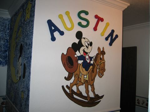 2002 Ford Taurus - A wall mural depicts Mickey Mouse on a rocking horse, with the name AUSTIN above.