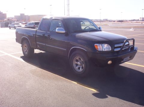 2003 Toyota Tundra - This black 2003 Toyota Tundra pickup truck is seen from a three-quarter front view in a parking lot.