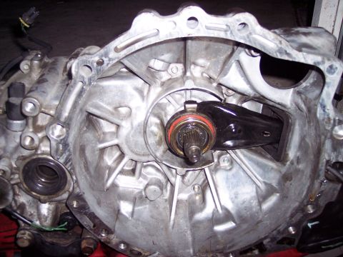 1995 Ford Probe - Close-up view of a transmission's clutch fork and input shaft assembly.