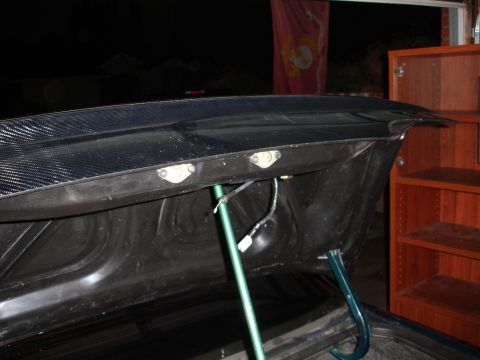 1993 Ford Taurus - Trunk lid interior with carbon fiber overlay and visible latching hardware.