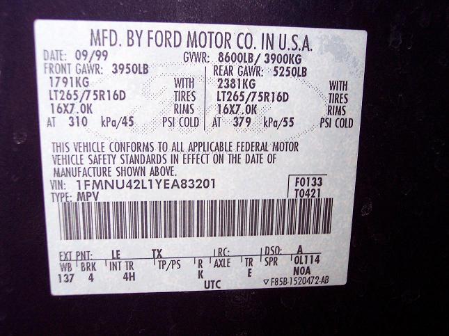 Ford door jamb safety certification label showing GVWR, tire/rim specs, and VIN 1FMNU42L1YEA83201, dated 09/99