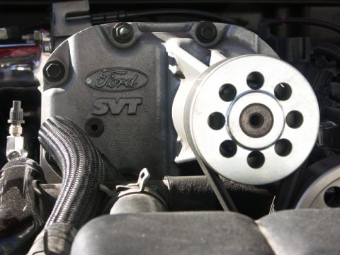 1979 Ford Bronco - Close-up of a Ford SVT supercharger assembly, showing the pulley and drive belt.