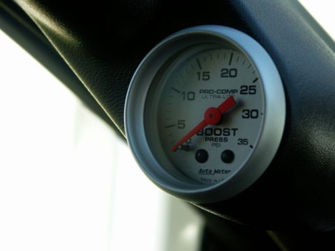 1979 Ford Bronco - Close-up of an Auto Meter boost pressure gauge, indicating PSI readings.