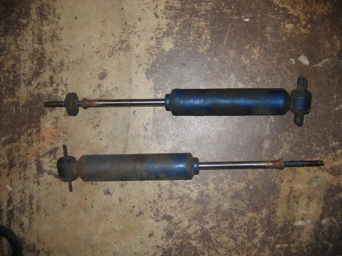 1985 Ford LTD Crown Victoria - Pair of blue shock absorbers shown on a textured floor.