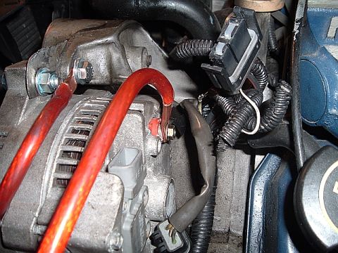 1994 Ford Thunderbird - here is the new nice and fat positive wire that will go directly to the positive terminal on the battery, to the left is the new engine gro…