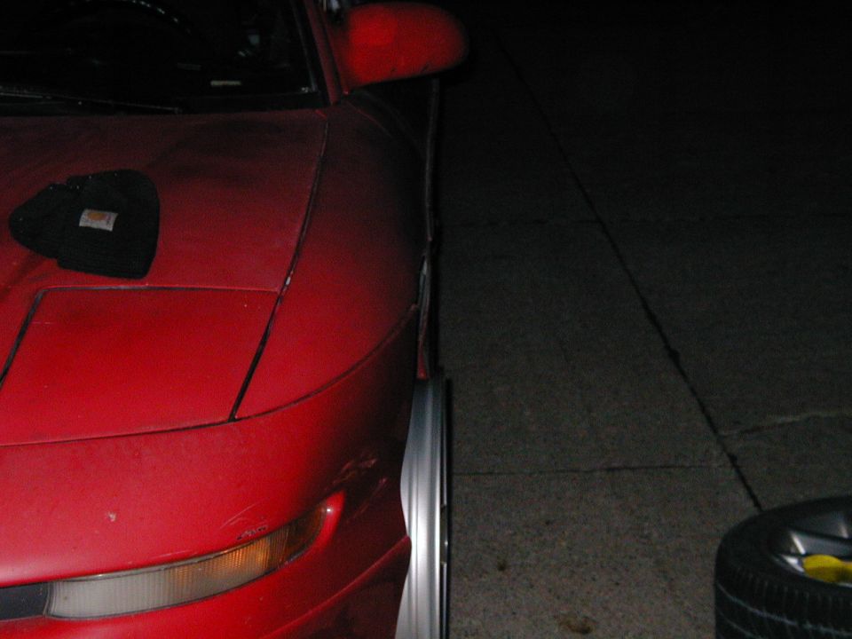 Harrumpff!!  This is how far the TSW's stick out.  Roughly 1/2 inch.  Low enough that I need to do one of two things--raise the car or sell the rims. #$*%