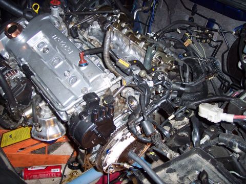 1995 Ford Probe - Close-up view of an engine bay, showing various mechanical components and wiring harnesses.
