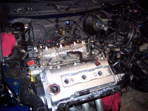1995 Ford Probe - The engine bay of a vehicle, showing the engine and various components.
