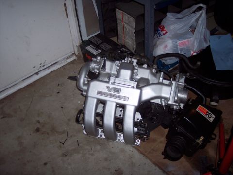 1995 Ford Probe - Engine part with V6 DOHC 24-valve labeling and a K&N air filter box.