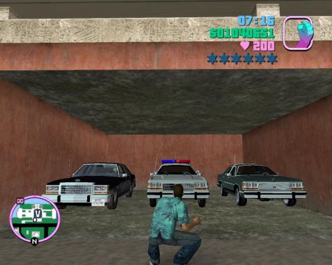 1991 Ford LTD Crown Victoria - A Grand Theft Auto: Vice City screenshot showing three modded box-body Ford LTD Crown Victoria sedans parked side by side in a concrete gar…