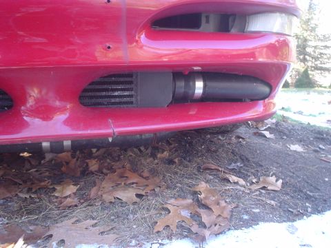 1995 Ford Probe - Aftermarket intercooler and piping installed on a 1995 Ford Probe's front end.