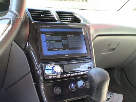 1997 Ford Probe - Aftermarket NESA screen and Kenwood stereo installed in a car's dashboard.