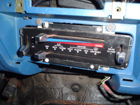 1984 Ford Bronco - Climate control panel showing fan speed, A/C, heater, and defrost options.