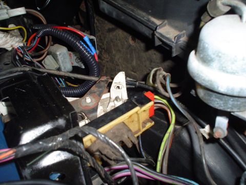 1984 Ford Bronco - This photo shows a complex network of wires and connectors within a vehicle's interior electrical system.