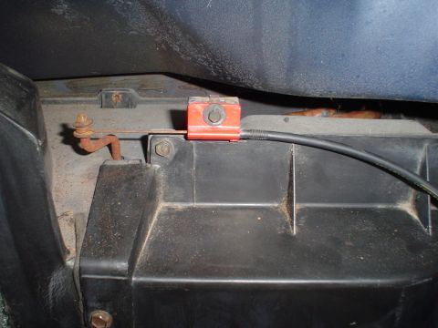 1984 Ford Bronco - Close-up view of an interior car component with visible rust and wiring.