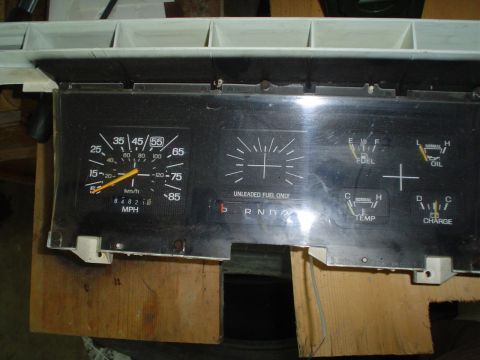 1984 Ford Bronco - This is a vehicle's instrument cluster, likely from the mid-1980s, showing various gauges and the gear selector.
