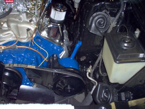 1970 Ford Ranchero - A close-up view of engine components, including a blue painted engine block and air filter housing.
