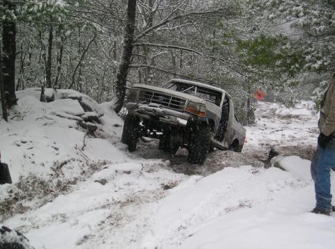 1995 Ford Bronco - Off-roading in a 1995 Ford Bronco during a snowy day.