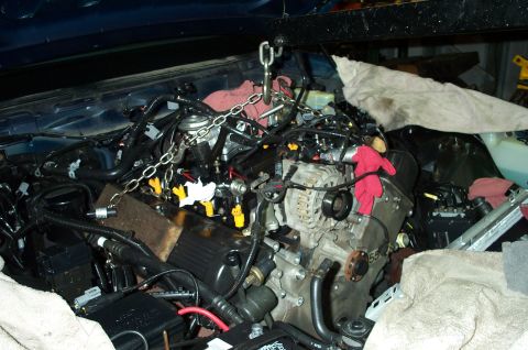 1998 Ford Crown Victoria - Removing the passenger side valve cover was impossible. So, the engine was unbolted and lifted forward.