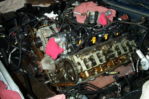 1998 Ford Crown Victoria - The engine's internal components are exposed for maintenance or repair.