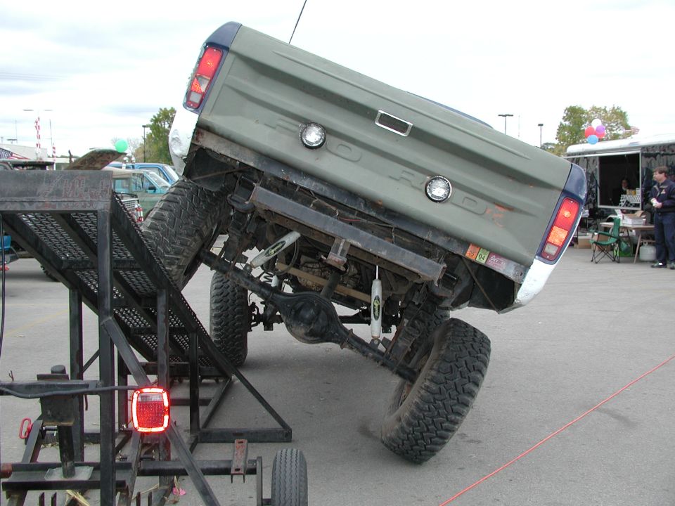 Rear view of a 1977 Ford F-150 on a trailer ramp