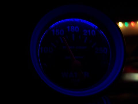 1995 Ford Probe - A car's water temperature gauge glows blue in the dark, showing a reading of 150.