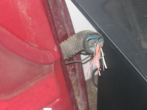 1991 Ford Bronco - The wiring harness for this vehicle is exposed, with multiple colored wires visible.