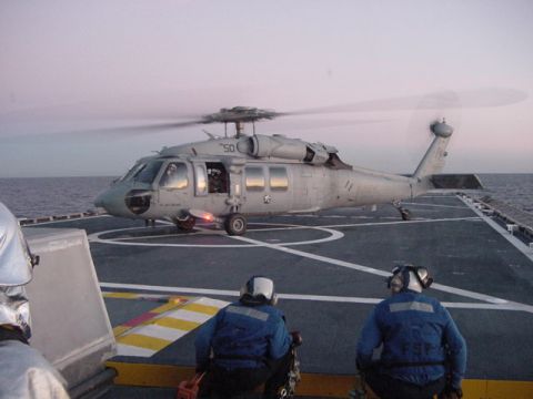 1978 Ford F-250 - A helicopter prepares for takeoff or landing on a ship's helipad at sea.
